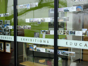 Picture of postcards installed in the PRC's front windows.