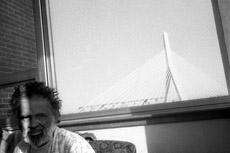 Portrait of a man with Zakim Bridge in the background.